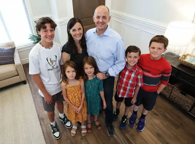 Logan Norton, left, Emily McMullin, Evan McMullin, Brynlee Norton, Maylee Norton, Gavin Norton and Colin Norton pose for a photo at their home in Highland on Friday, Aug. 5, 2022.