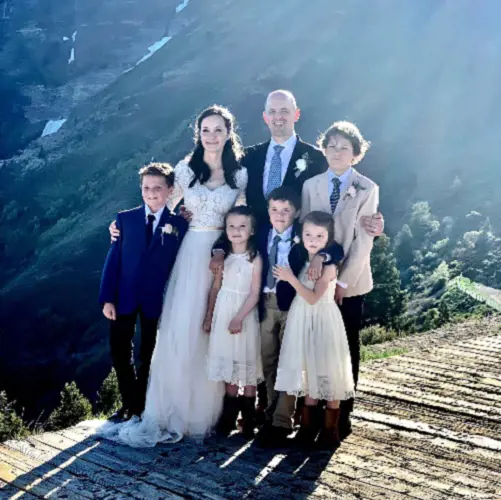 Emily Norton and Evan McMullin with their five children at their wedding day on June 2021.