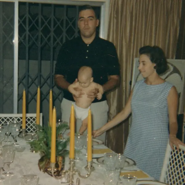 Bryan pictured with his parents at young age 